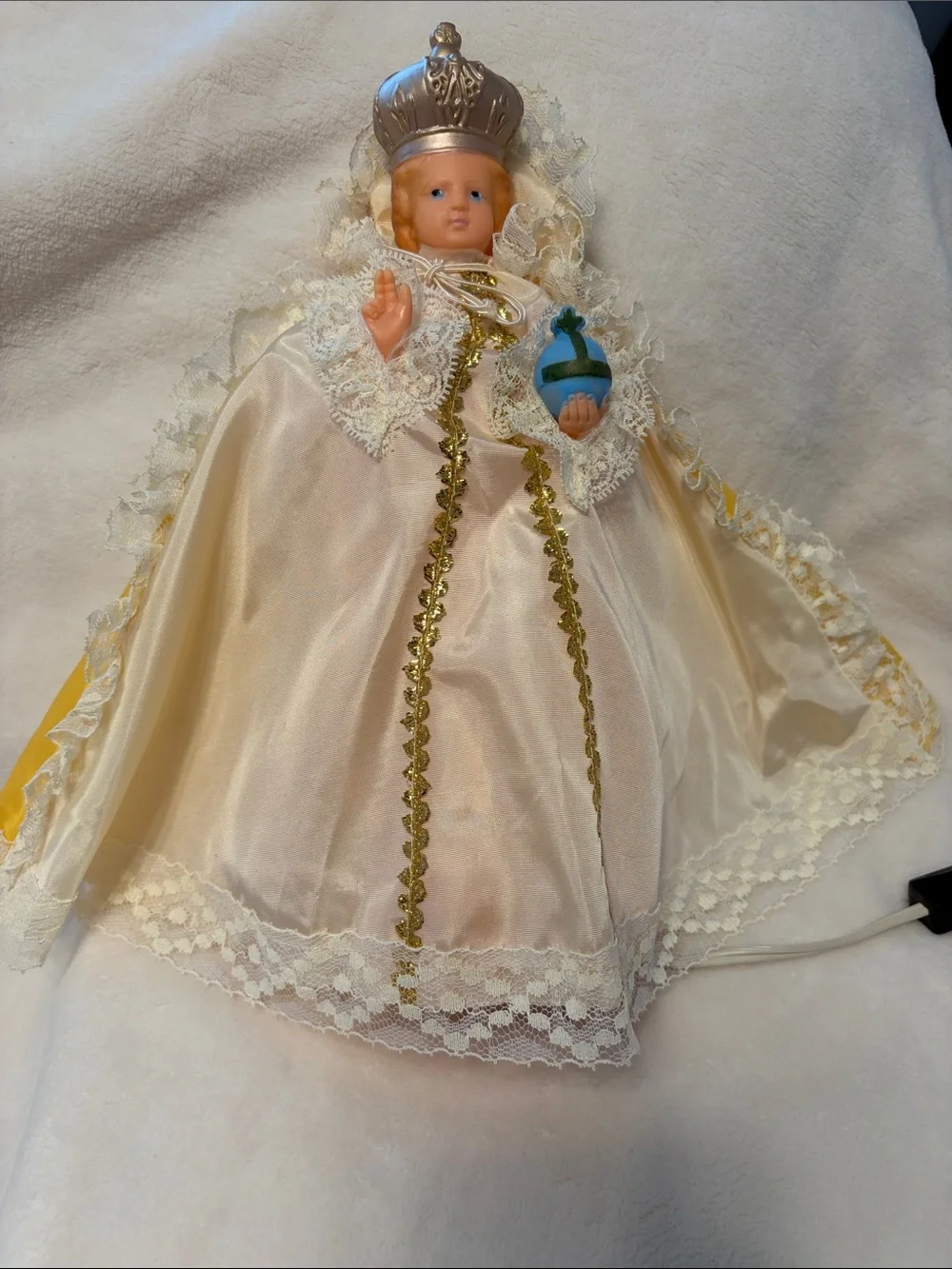 Vintage infant Jesus of Prague with light